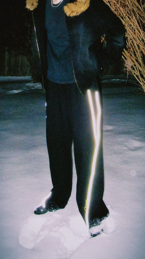 Reflection sweats glowing under flash in the snow
