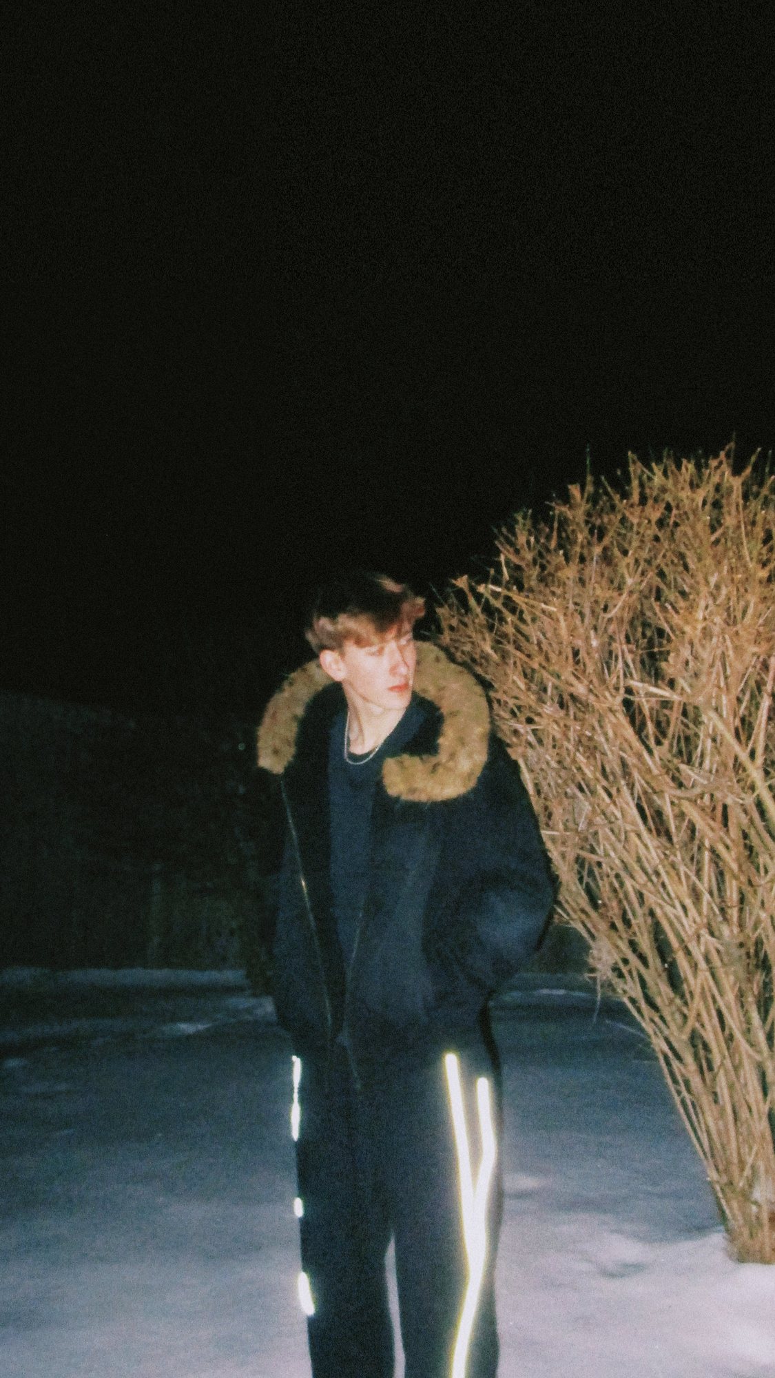 Boothy in the Sun Fade fur hoodie and Reflection sweats at night in the snow